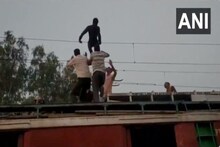 বিদ্যুৎ পৰিবাহী তাঁৰত এজন যুৱক, উদ্ধাৰ কৰিবলৈ আহিল ৰে’ল, চাওক VIDEO