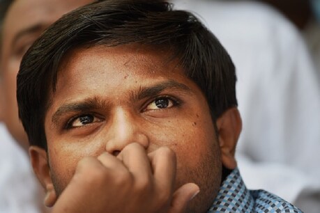 Indian convenor of the 'Patidar Anamat Andolan Samiti', Hardik Patel, who led recent protests in the state of Gujarat demanding preferential treatment regarding jobs and university places for the Patidar caste, looks on during a press conference in New Delhi on August 30, 2015. A firebrand protest leader vowed August 30 to spread agitation over caste preferences nationwide, just days after the worst violence in more than a decade in western India left nine people dead. AFP PHOTO / SAJJAD HUSSAIN (Photo credit should read SAJJAD HUSSAIN/AFP/Getty Images)