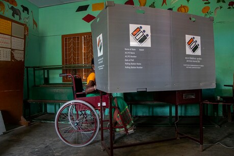 A tea garden worker casts her vote at a polling station during the first phase of Assam state elections in Jorhat, India, Saturday, March 27, 2021. Two Indian states with sizeable Muslim populations began voting in local elections Saturday in a test of strength for Prime Minister Narendra Modi, whose Hindu nationalist agenda is being challenged by monthslong farmer protests and a fresh wave of the pandemic. (AP Photo/Anupam Nath)