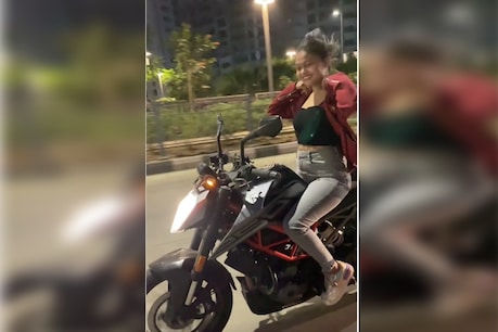 The girl had to look stunted on the bike.