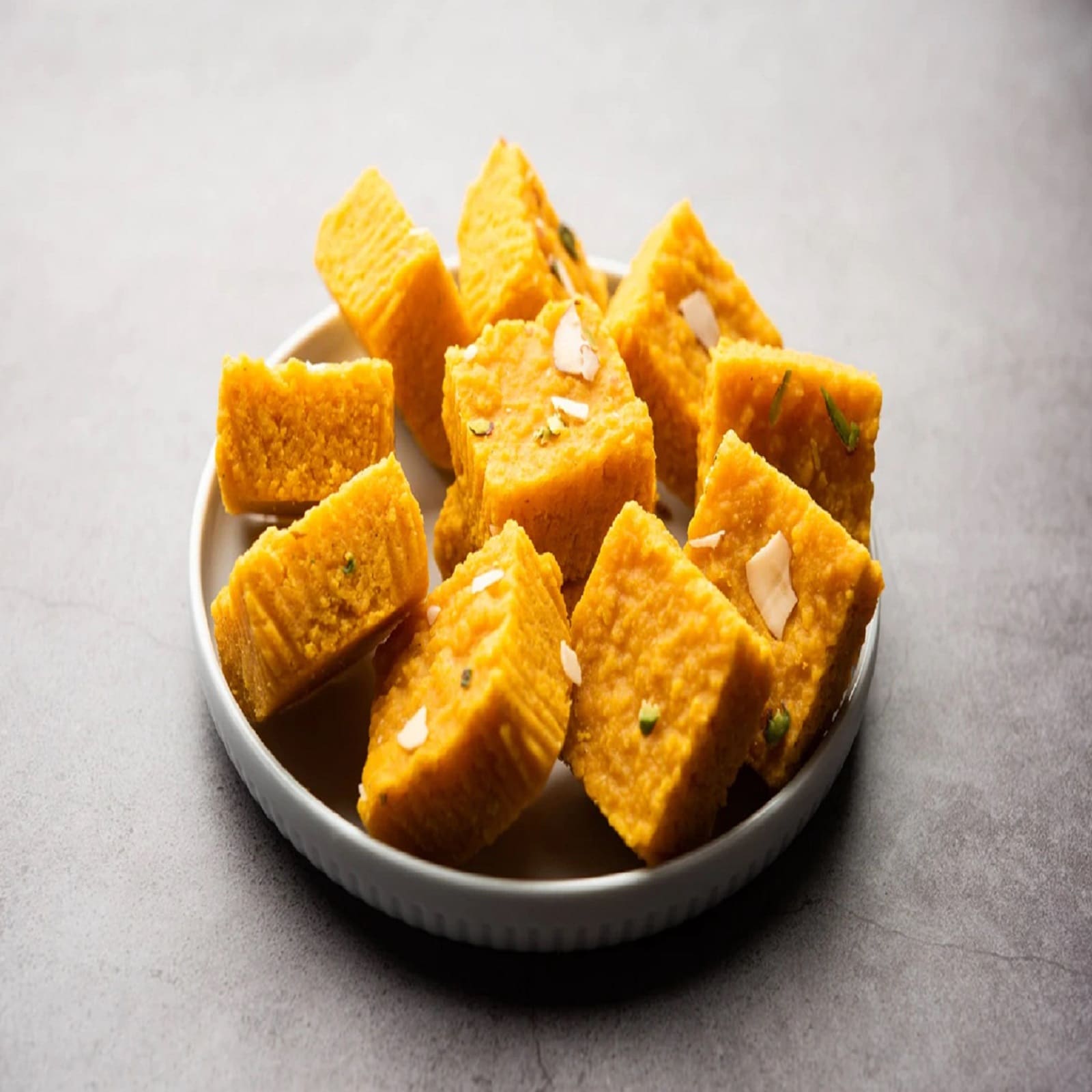 In the festive season, different types of sweets can be made at home at home. In such a situation, if you make Nuts Barfi and feed it to the guests who come home, then you will get a lot of praise. It will be ready in very less time. (Image- Shutterstock)