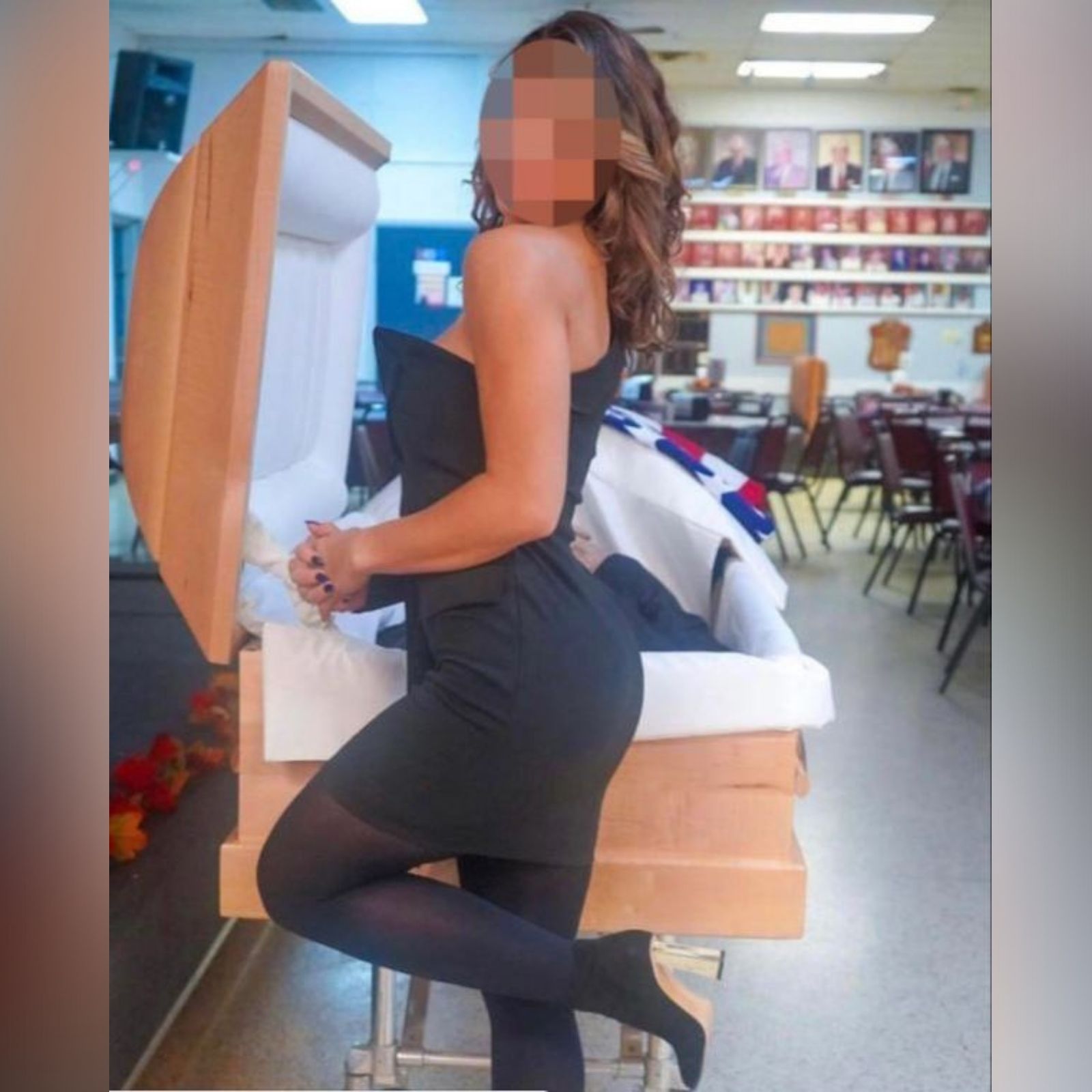 woman shares photo in glamourous pose in front of father dead body