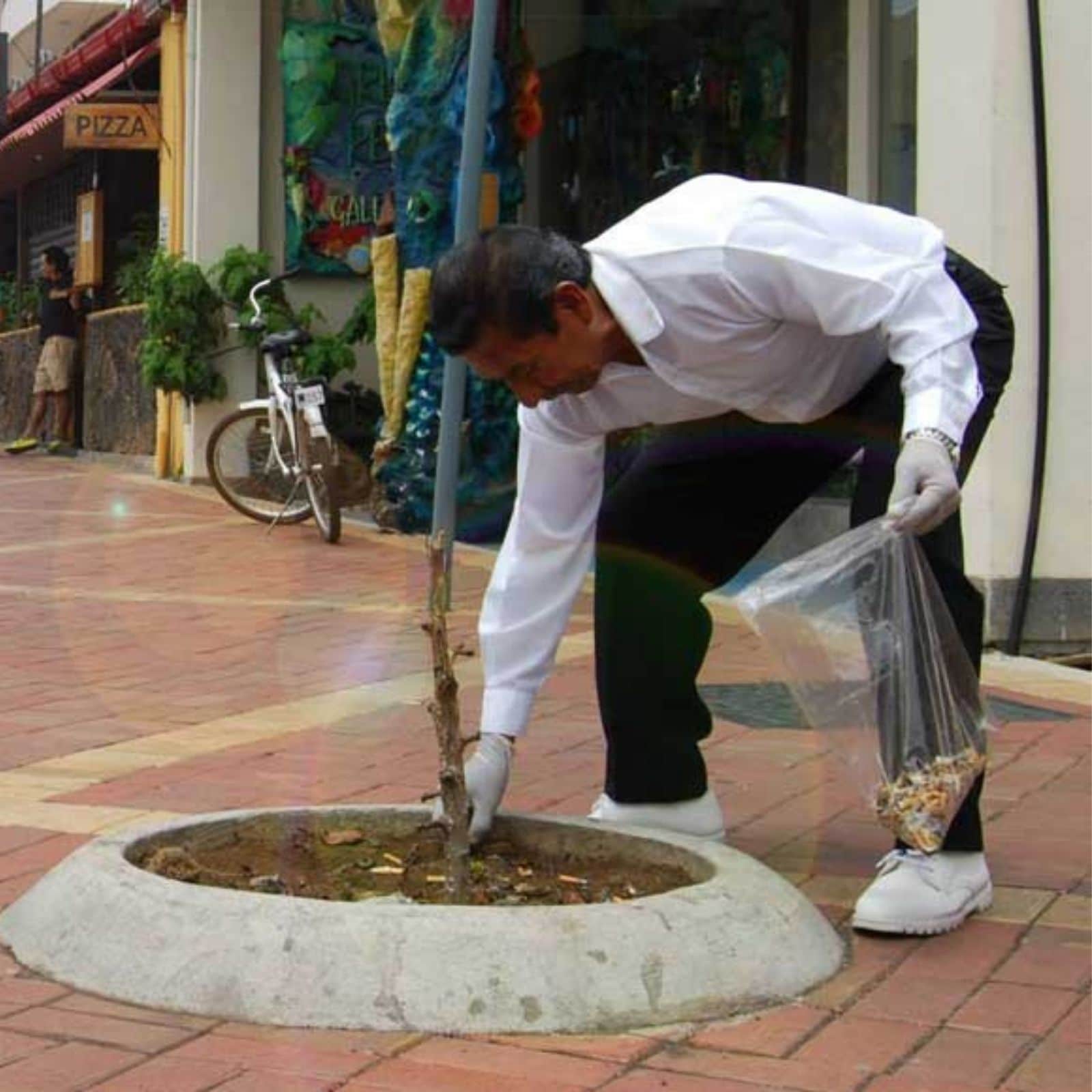 Man collects cigarette butts 1