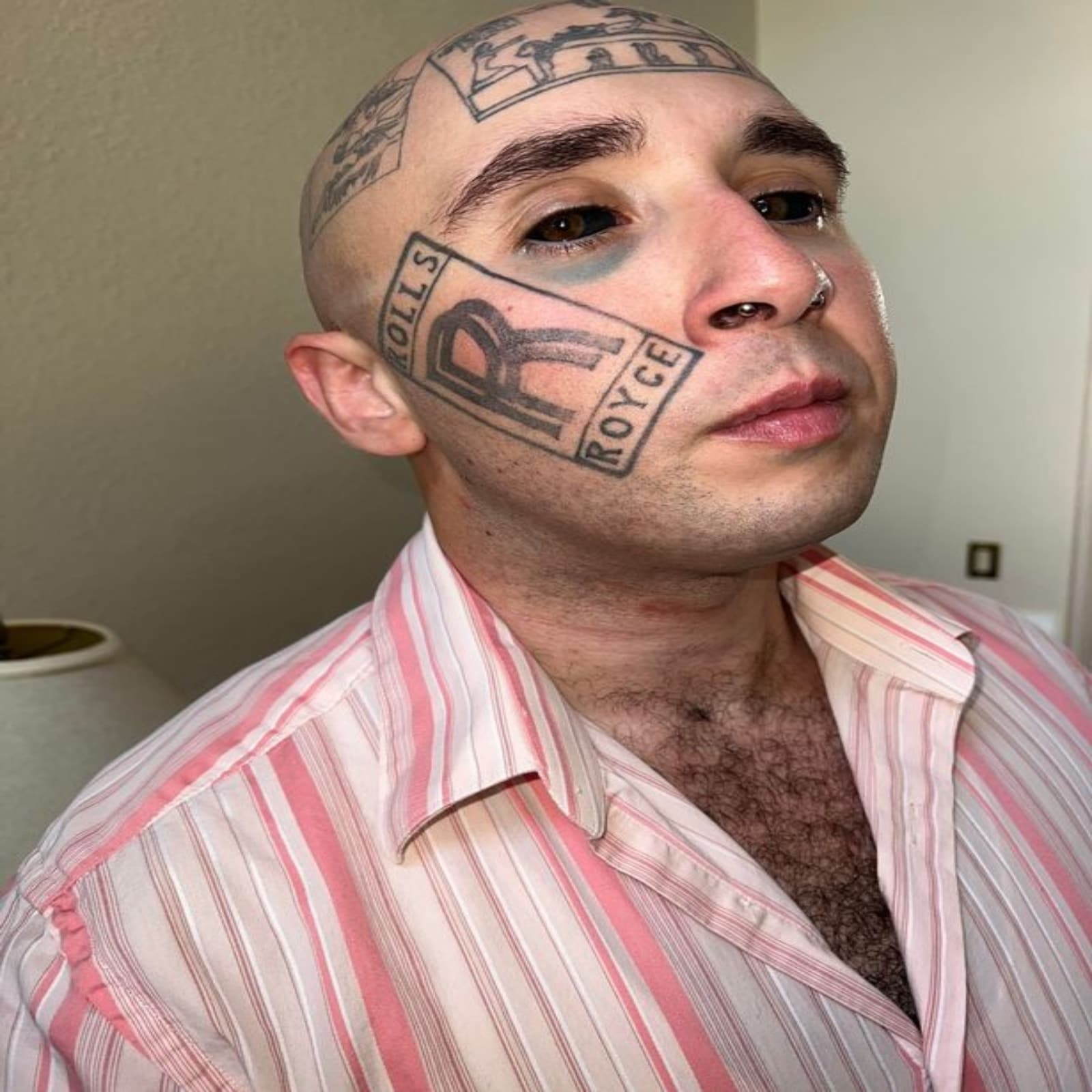 man with rolls royce tattoo