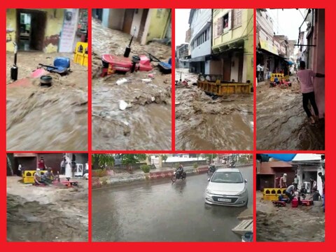 टोंक के छोटा बाजार बाबरों के चौक के पास गली में पानी में बहता ट्रैक्टर.