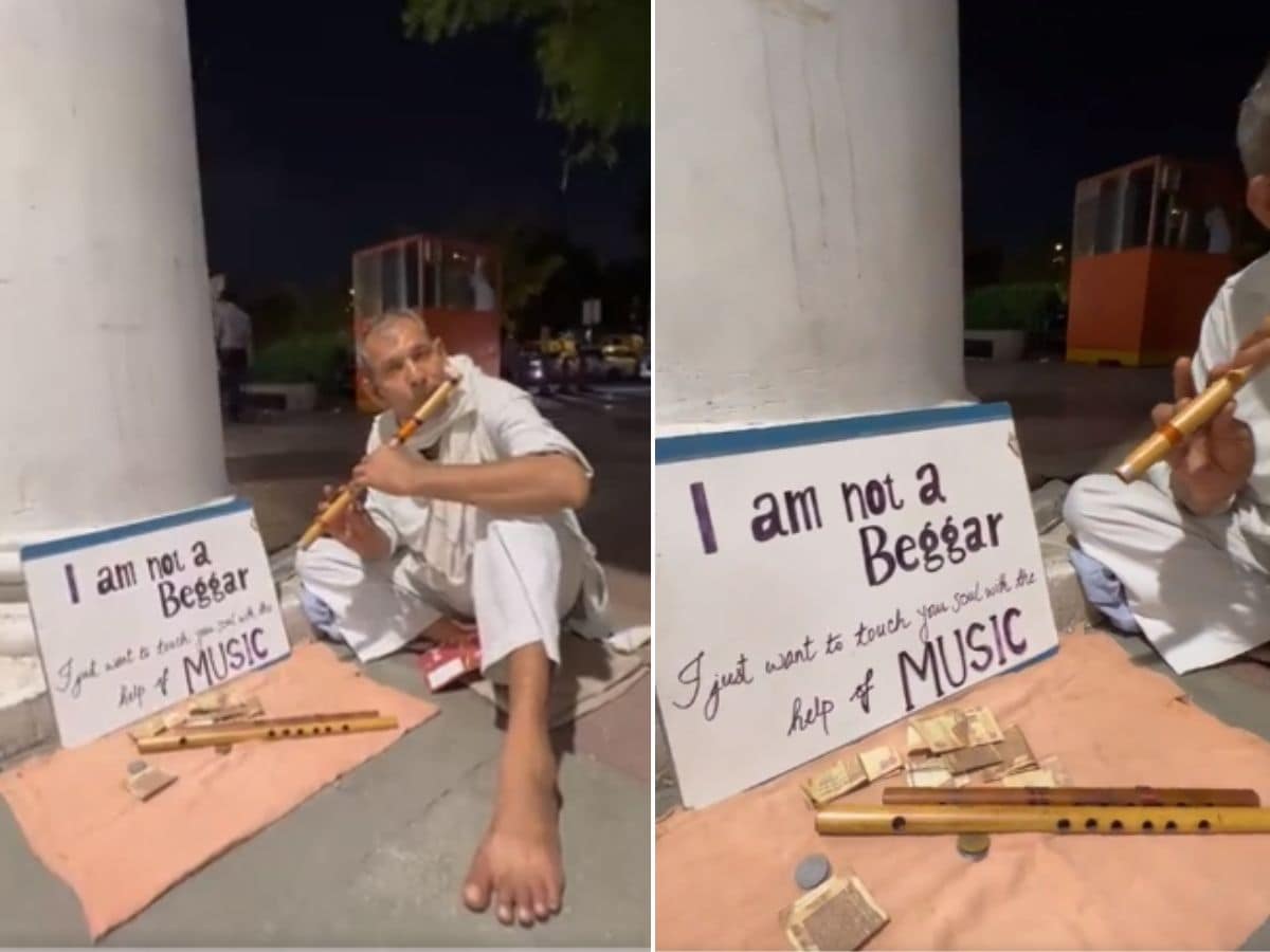man playing flute in delhi
