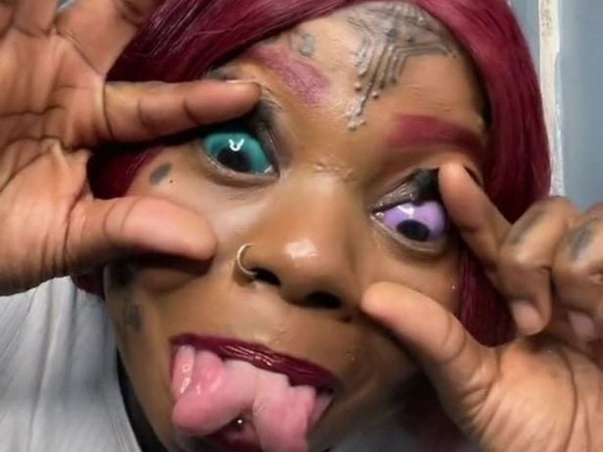 Cool Green Demon Eyeball Tattoo With Ripped Face – Truetattoos