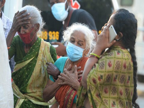 WHO ने कहा कि दुनिया से कोरोना को खत्म नहीं किया जा सकता. (AFP via Getty Images)