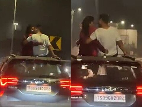 कपल कार के सनरूफ से बाहर निकलकर किस करते हुए दिख रहे हैं. (फोटो: Twitter/@DharaniBRS)