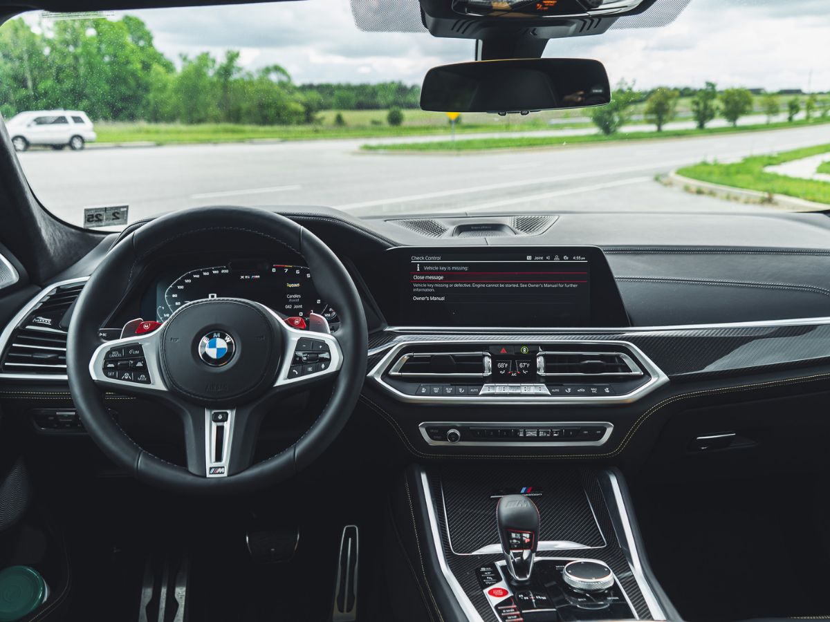 Why is the steering wheel in a car on the side and not in the middle