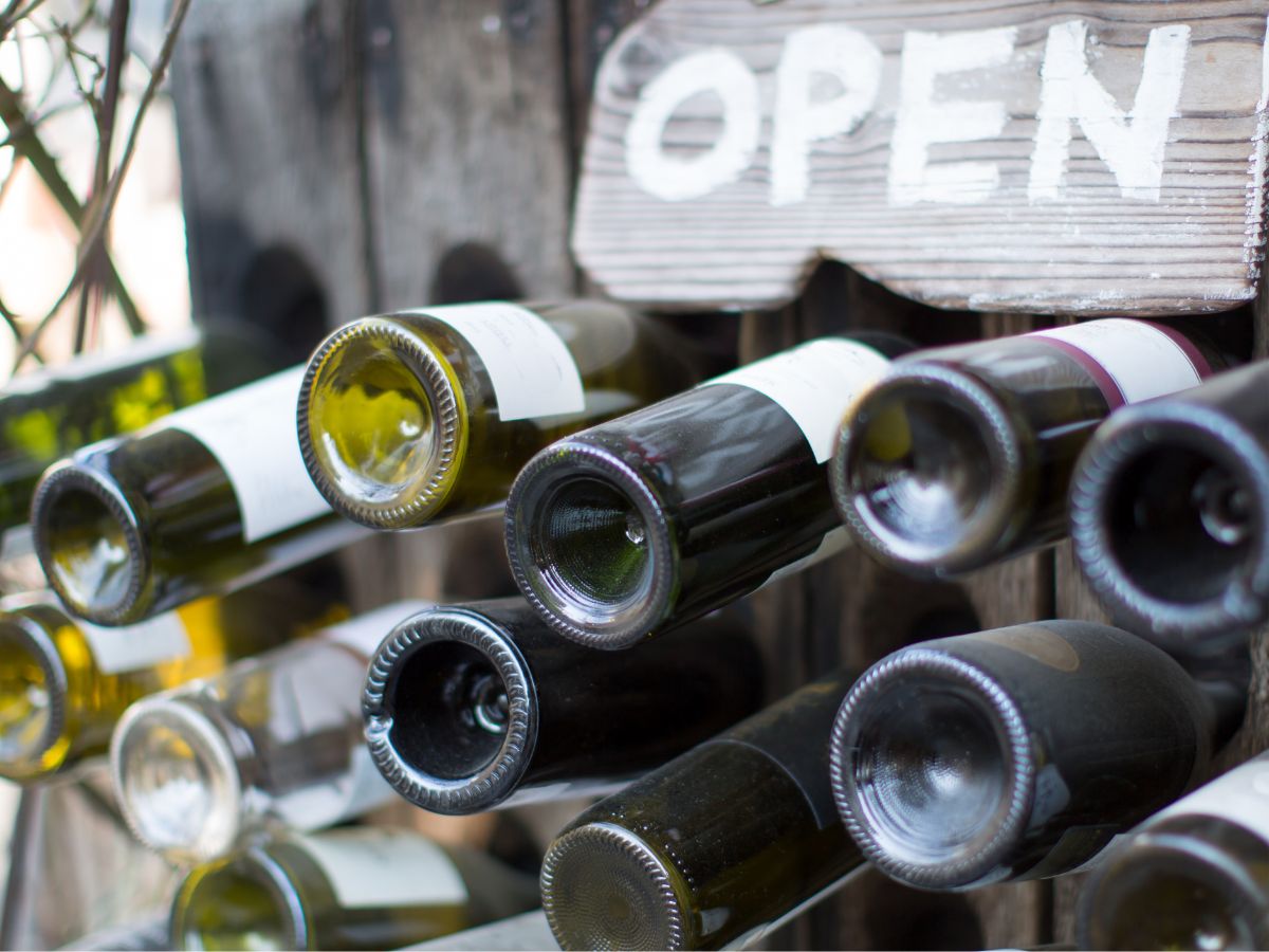 Why is the bottom of a wine bottle not flat? What is the reason for the