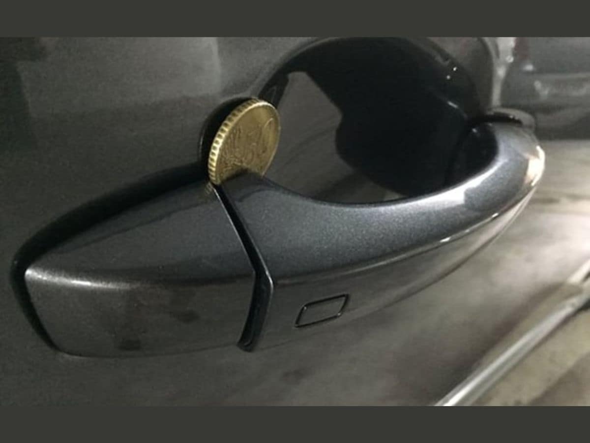 car door handle coin, coin trick to steal car, steal car using coin, stealing car using coin, coin car steal, coin car theft, coin car thief, coin trick at door handle, car door handle coin trick