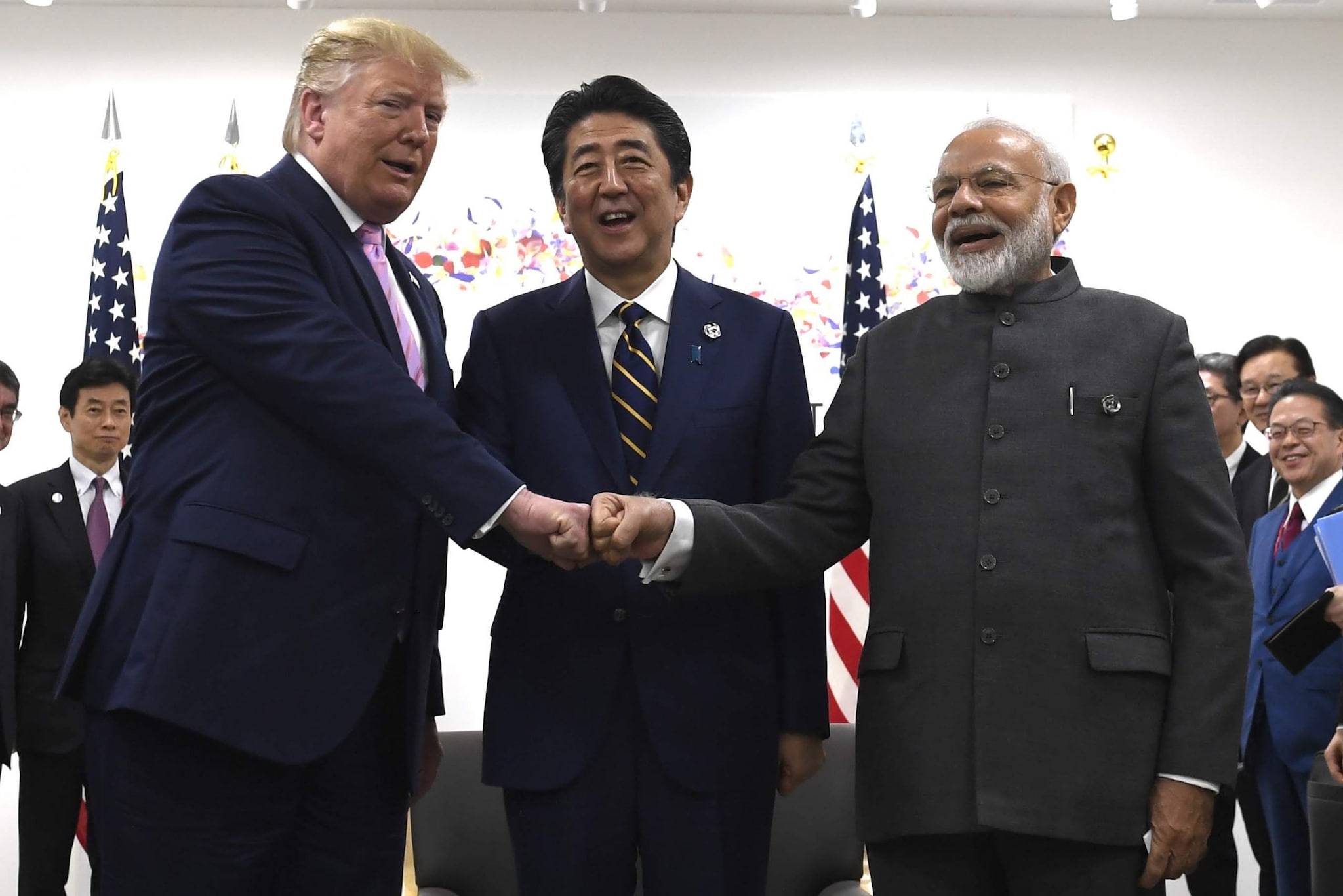 FILE- In this June 28, 2019 record  photo, President Donald Trump, Japanese Prime Minister Shinzo Abe and Indian Prime Minister Narendra Modi stock  a fist bump during their gathering  connected  the sidelines of the G-20 acme  successful  Osaka, Japan. These days, Modi is seen astir   the satellite   arsenic  a cardinal  Asian leader. He’s known for welcoming overseas   heads of authorities   with carnivore  hugs. He has addressed a associated  league   of the U.S. Congress. (AP Photo/Susan Walsh, File)