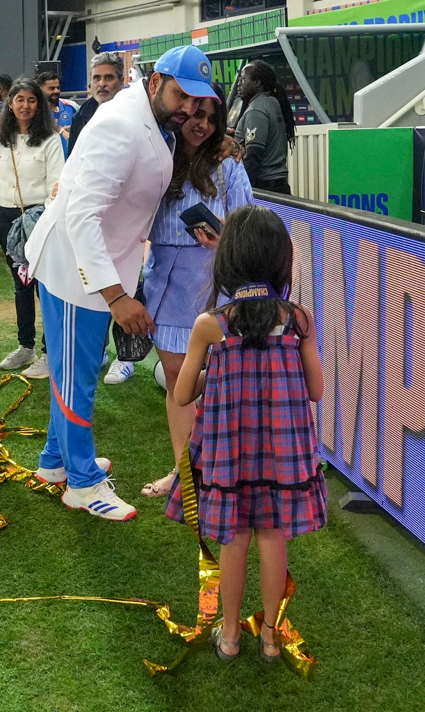 Dubai: Indian cricket team captain Rohit Sharma with his family after India won against New Zealand in the ICC Champions Trophy 2025 final cricket match, in Dubai, UAE, Sunday, March 9, 2025. India won by 4 wickets to lift the ICC Champions Trophy 2025. (PTI Photo/Arun Sharma) (PTI03_10_2025_000006B) *** Local Caption *** Go