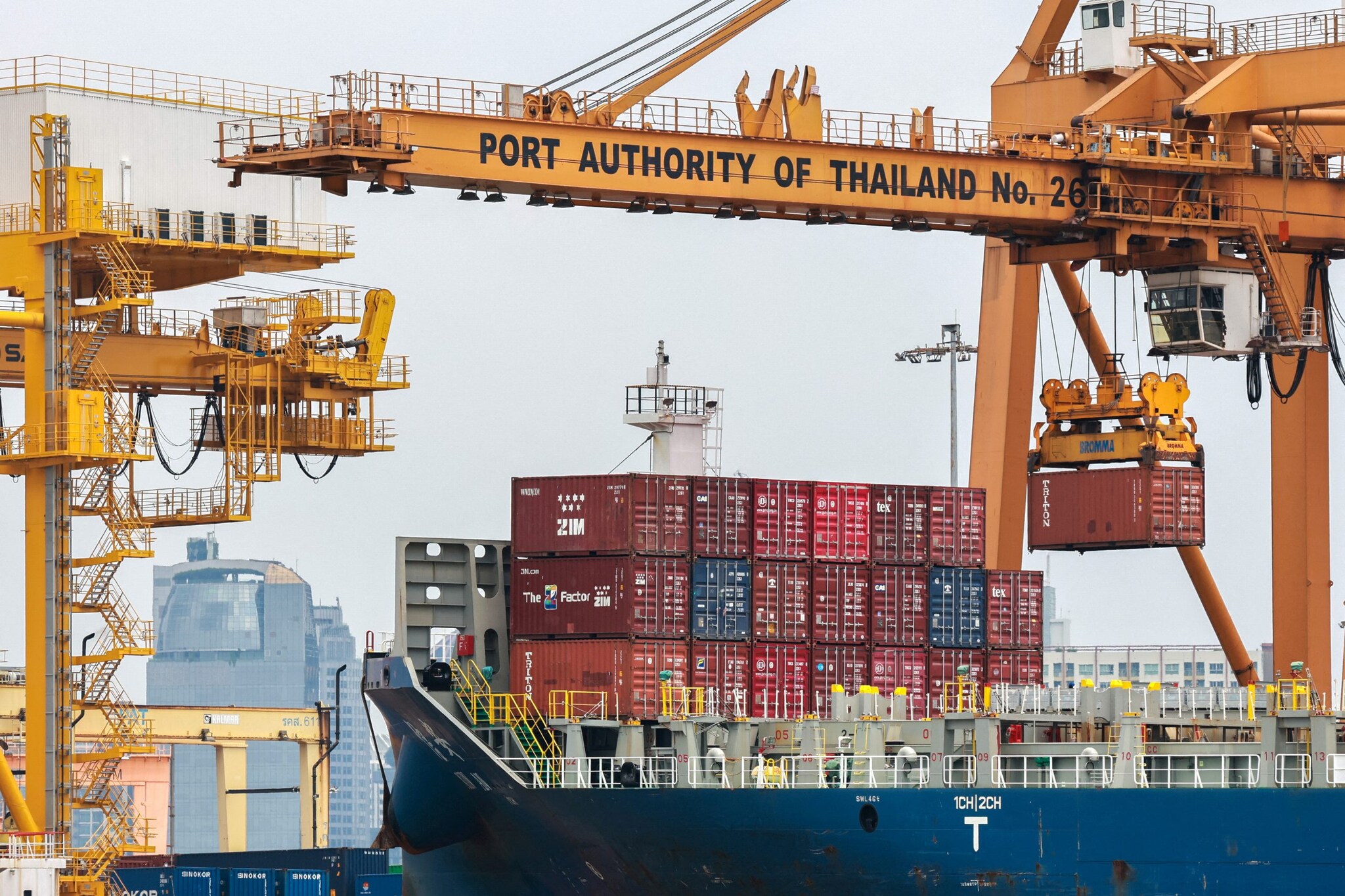 Cargo ships are loaded with containers as it is docked at the port of Bangkok, in Bangkok, Thailand, April 3, 2025. Thailand, with a tariff rate of 37 per cent imposed by U.S. President Donald Trump, is one of six countries in the Southeast Asian region slapped with much higher-than-expected tariffs by the U.S. REUTERS/Athit Perawongmetha