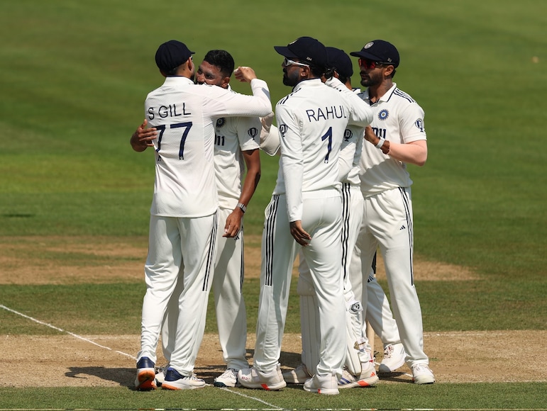 Indian team celebrates after taking wickets Indian team celebrates after taking wickets