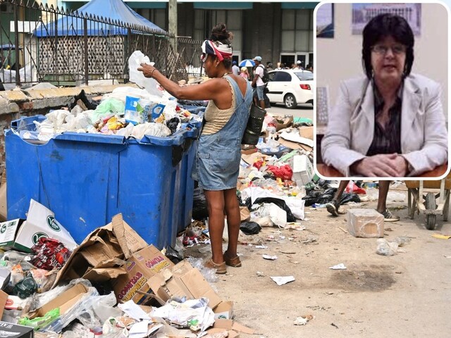 People searching for food in garbage