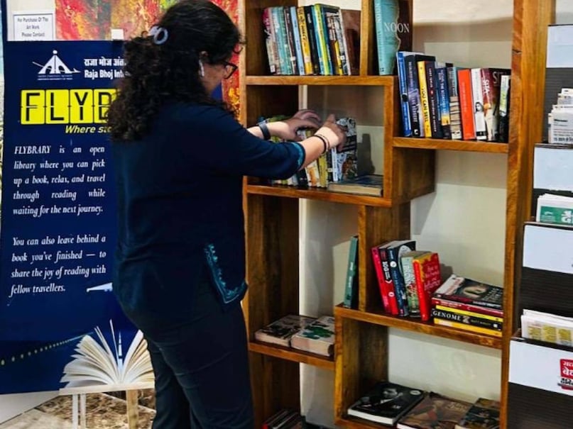 AAI Flybrary, Indian Airports, Bhopal Airport Library, Imphal Airport, Bikaner Airport, Airport Reading Zone, AAI Initiative, Flybrary Project, Reading Corner India, Airport Books, एएआई फ्लाइब्रेरी, एयरपोर्ट लाइब्रेरी, भोपाल एयरपोर्ट, इंफाल एयरपोर्ट, बीकानेर एयरपोर्ट, एयरपोर्ट पर किताबें, फ्लाइब्रेरी पहल, इंडियन एयरपोर्ट अथॉरिटी, रीडिंग कॉर्नर, यात्रा अनुभव AAI Flybrary, Indian Airports, Bhopal Airport Library, Imphal Airport, Bikaner Airport, Airport Reading Zone, AAI Initiative, Flybrary Project, Reading Corner India, Airport Books, एएआई फ्लाइब्रेरी, एयरपोर्ट लाइब्रेरी, भोपाल एयरपोर्ट, इंफाल एयरपोर्ट, बीकानेर एयरपोर्ट, एयरपोर्ट पर किताबें, फ्लाइब्रेरी पहल, इंडियन एयरपोर्ट अथॉरिटी, रीडिंग कॉर्नर, यात्रा अनुभव