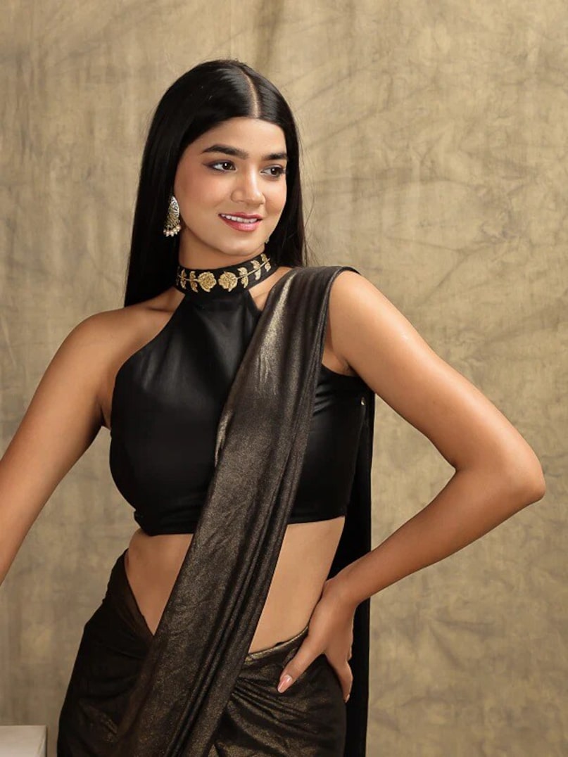Halter Neck Blouse: This stylish halter neck blouse can be paired with lehenga or georgette saree. This design gives a young and trendy look and is perfect for summer events.