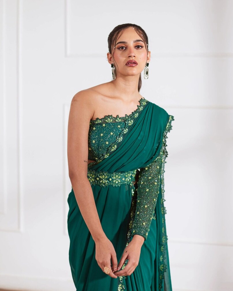 One Shoulder Blouse: If you want a western touch in your traditional attire then one shoulder blouse is a great option. You can wear it with both saree and skirt, which will give you a glamorous and fresh look.