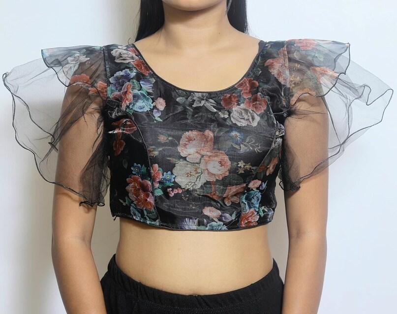 Sheer Fabric Blouse: For special occasions, you can wear transparent or sheer fabric blouses elegantly. These designs are perfect for giving a modern and sensual touch to the saree.