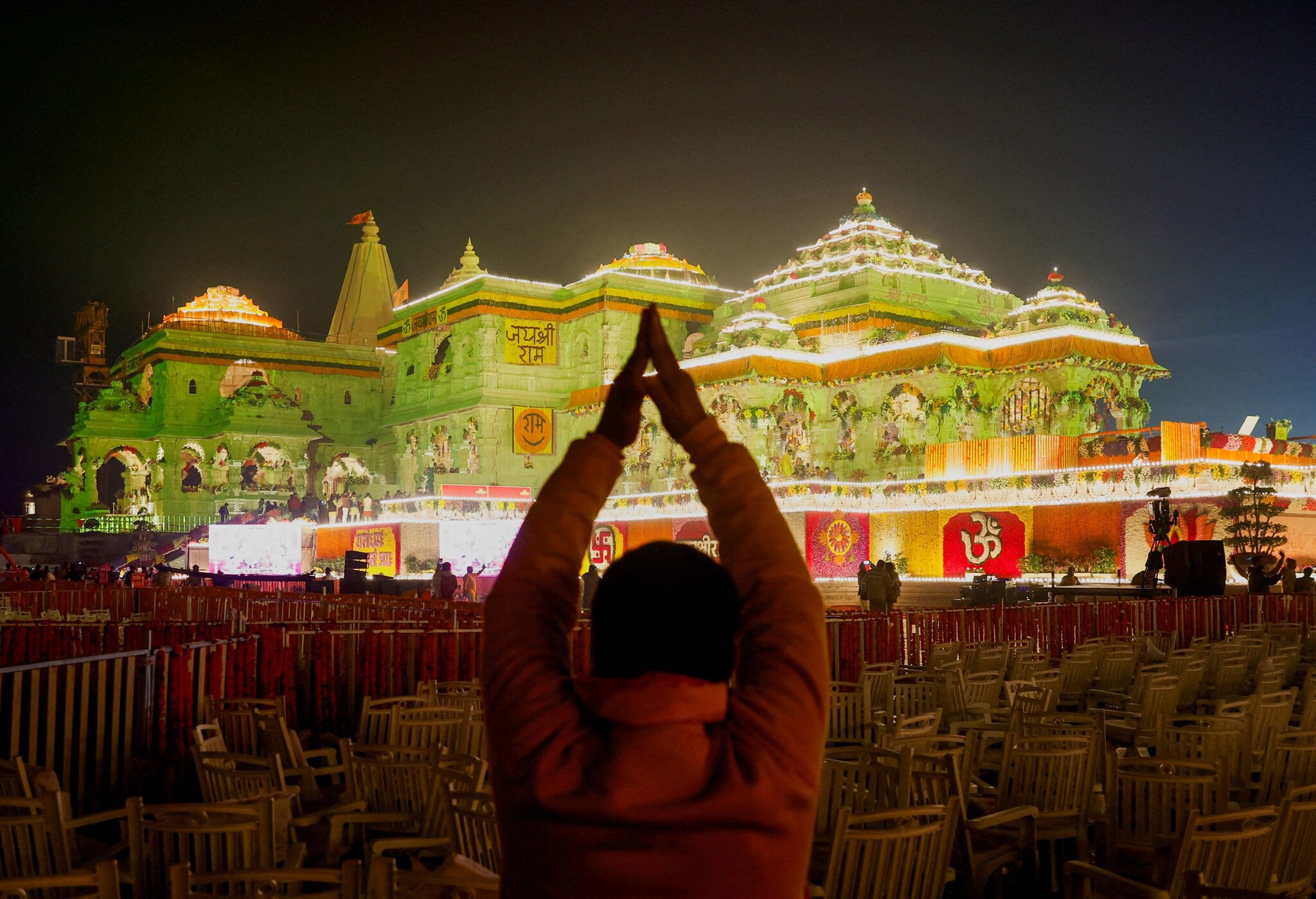 A Hindu devotee prays near the Lord Ram temple after its inauguration, in Ayodhya, India, January 22, 2024. REUTERS/Adnan Abidi     TPX IMAGES OF THE DAY