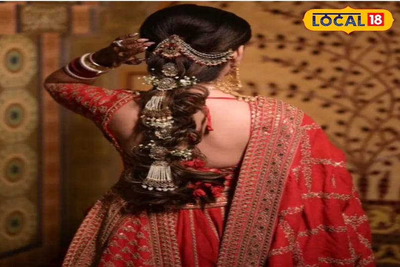 भारी लटकन वाले आभूषणों के साथ दुल्हन की लटों वाली पोनीटेल