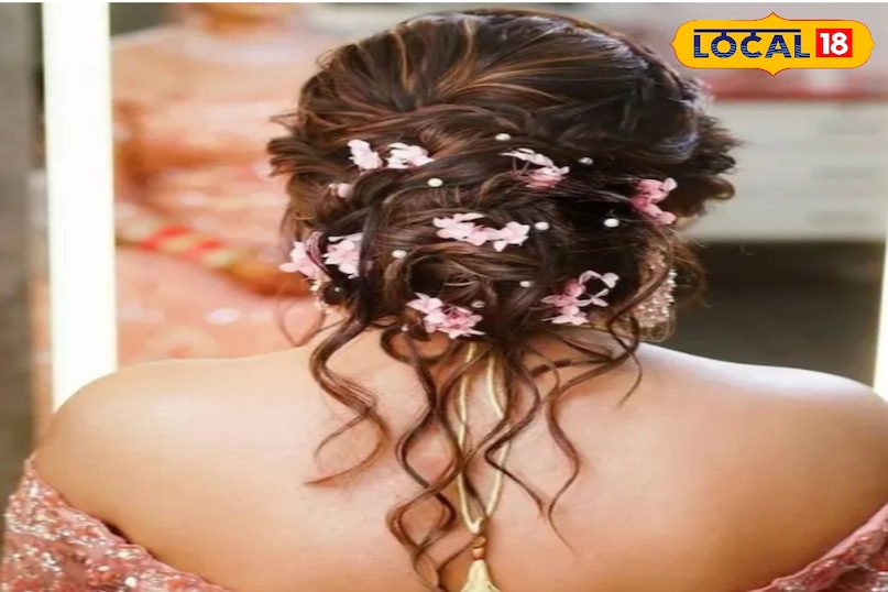 गुलाबी फूलों के साथ मेसी बन