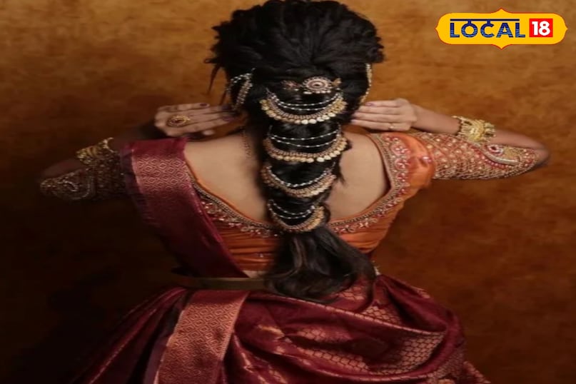 सोने के बाल आभूषण के साथ सुरुचिपूर्ण ब्रेडेड बन