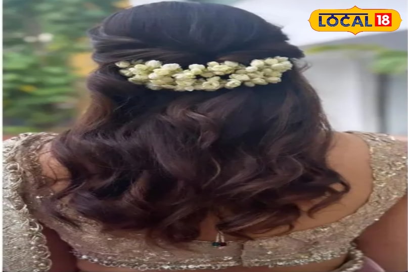 चमेली के फूलों के साथ मुलायम लहरदार हेयरस्टाइल