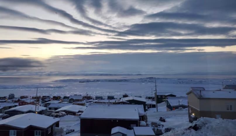 Iqaluit, Canada: The capital of Nunavut endures average winter temperatures around –27°C, often dipping even lower. Life here depends on highly insulated homes and a combination of imported supplies and locally hunted caribou and fish to survive the frozen tundra. Iqaluit, Canada: The capital of Nunavut endures average winter temperatures around –27°C, often dipping even lower. Life here depends on highly insulated homes and a combination of imported supplies and locally hunted caribou and fish to survive the frozen tundra.