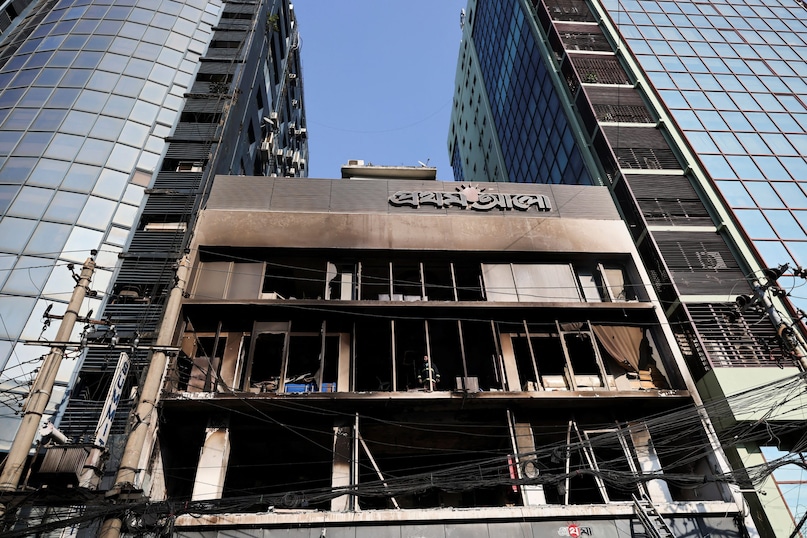 A firefighter works inside the building of vandalised Prothom Alo newspaper's office, following the death of Sharif Osman Hadi, a student leader, who had been undergoing treatment in Singapore after being shot in the head, in Dhaka, Bangladesh, December 19, 2025. REUTERS/Mohammad Ponir Hossain