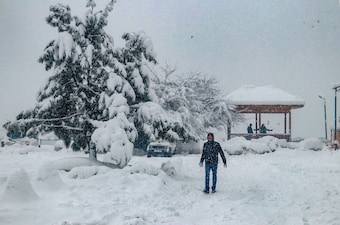 Tangmarg: A snow-covered road after fresh snowfall, at Tangmarg area of north Kashmir, Tuesday, Feb. 20, 2024. (PTI Photo) (