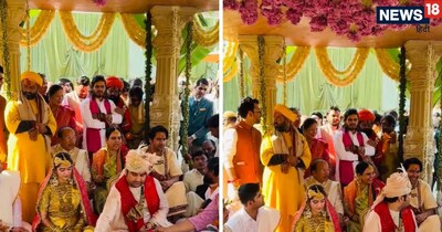 Indresh Upadhyay Shipra Sharma Marriage: राजस्थान की गुलाबी नगरी जयपुर रविवार को एक खास शादी का गवाह बनी, जहां वृंदावन के प्रसिद्ध कथावाचक इंद्रेश उपाध्याय और हरियाणा की रहने वाली शिप्रा जीवनभर के बंधन में बंध गए. परिवार, रिश्तेदार और साधु-संतों की मौजूदगी में संपन्न हुए इस शुभ विवाह में पारंपरिक रस्में, हल्दी की खुशबू, संगीत की धुन और रिश्तों की गर्माहट साफ झलकती रही. इस विवाह में कई धीरेंद्र शास्त्री, कुमार विश्वास समेत कई मशहूर धार्मिक हस्तियां और बॉलीवुड सितारे शामिल हुए. जयपुर का ताज आमेर होटल रोशनी और सजावट से जगमगा रहा है. बताया जा रहा है कि सुरक्षा से लेकर तैयारियों तक, सब कुछ एक बड़े आयोजन की तरह किया गया है.