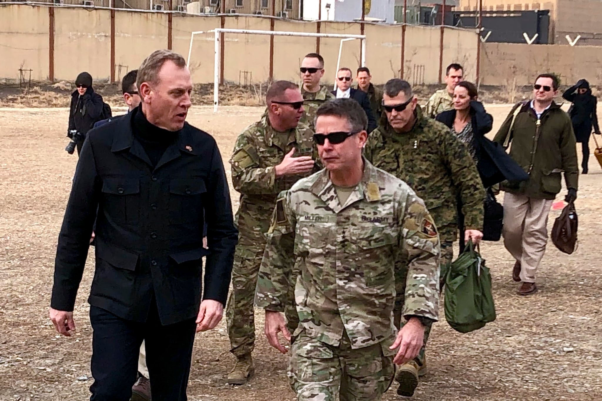 Acting Defense Secretary Pat Shanahan, left arrives in Kabul, Afghanistan, Monday morning, Feb. 11, 2019, to consult with Army Gen. Scott Miller, right, commander of U.S. and coalition forces, and senior Afghan government leaders. The unannounced visit is the first for the acting secretary of defense, Pat Shanahan. He previously was the No. 2 official under Jim Mattis, who resigned as defense chief in December. (AP Photo/Robert Burns)