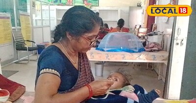 बच्चे को दूध पिलाती मां