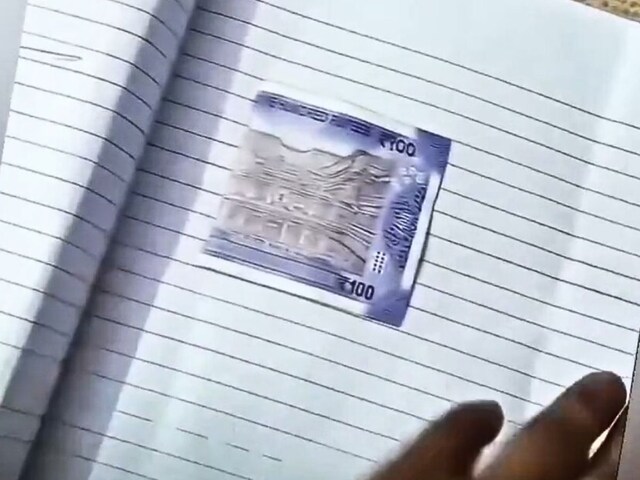 Master opened the student's answer sheet and saw a Rs 100 note stuck inside!