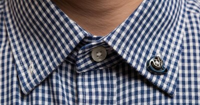 Unraveling the Mystery: Why Shirts Have Two Buttons Under the Collar