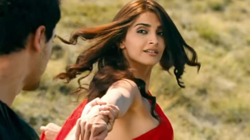 Another sequence shows Sonam Kapoor in a striking red saree while Imran Khan appears in a black sheer shirt. This visual is a tribute to the unforgettable song Suraj Hua Maddham from Kabhi Khushi Kabhie Gham. The original featured Shah Rukh Khan and Kajol against breathtaking desert landscapes. The styling and romantic framing in “Sadka Kiya” subtly echo that classic moment.