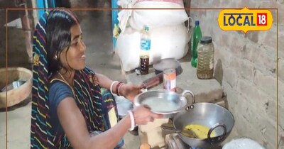 गोबर बायोगैस परियोजना से खाना बनाती महिलाएं 