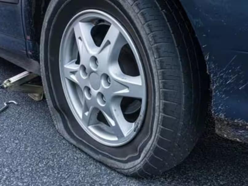 punctured car tire punctured car tire