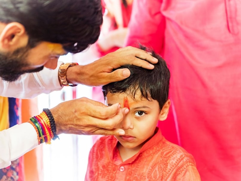 which finger for tilak