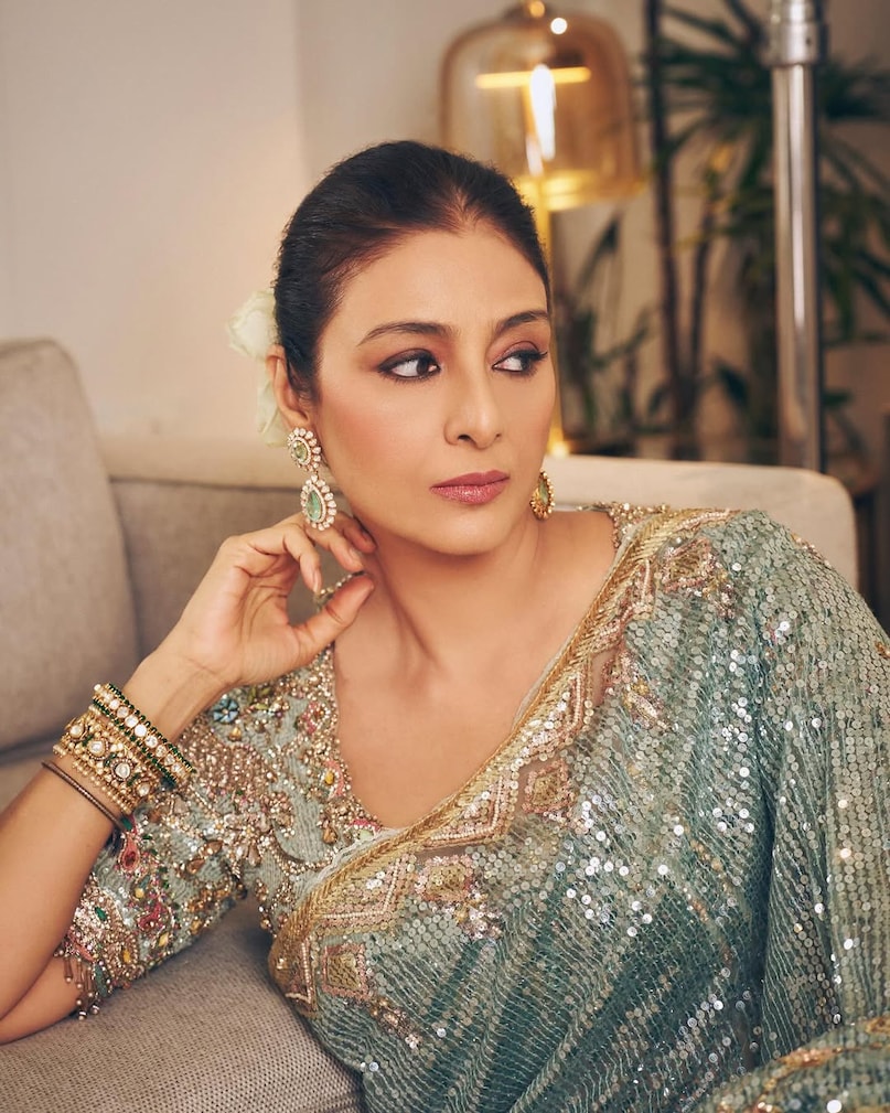 Tabu frosted blue saree look, तबु फ्रॉस्टेड ब्लू साड़ी लुक, Tabu sequin tulle saree, तबु सीक्विन ट्यूल साड़ी, Art deco saree design, आर्ट डेको साड़ी डिजाइन, Birds of Paradise saree, बर्ड्स ऑफ पैराडाइज साड़ी, tabu latest look,tabu saree look, how to style a frosted blue saree,tabu vintage royal look tips,birds of paradise motif saree, art-deco pattern saree design,edwardian lace blouse ideas,modern saree draping for weddings,best saree for summer events 2026,celebrity fashion tips