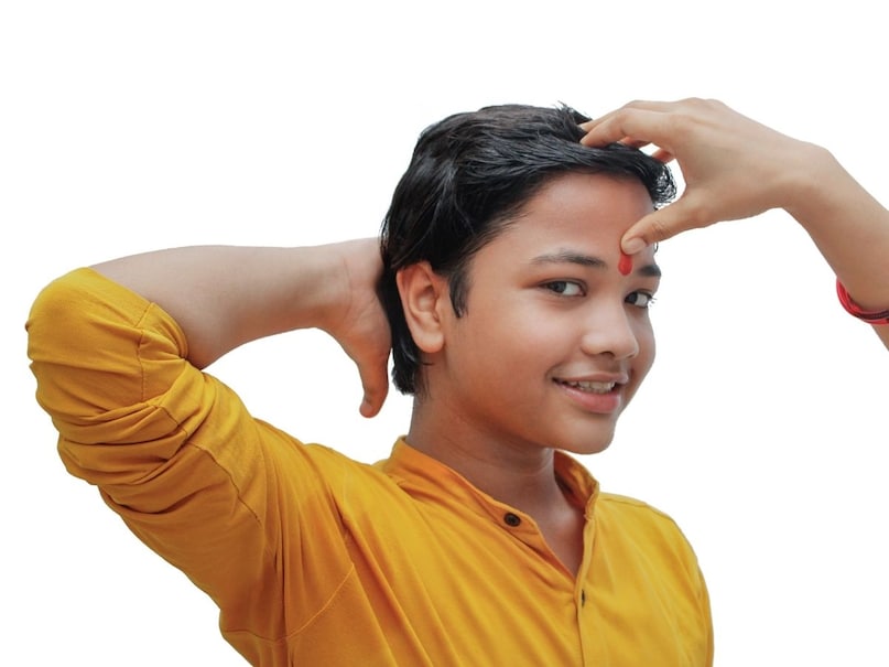 which finger for tilak