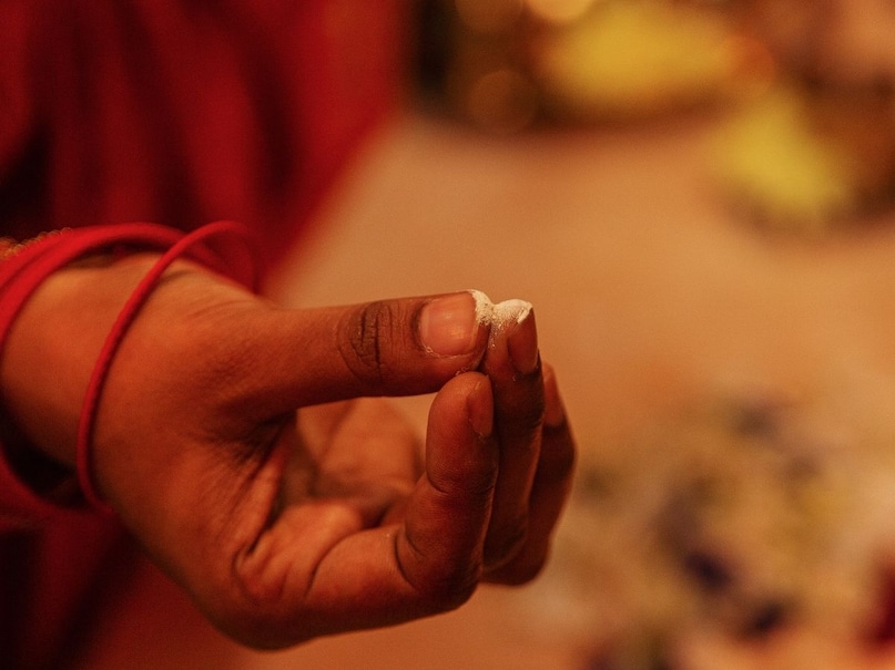 which finger for tilak