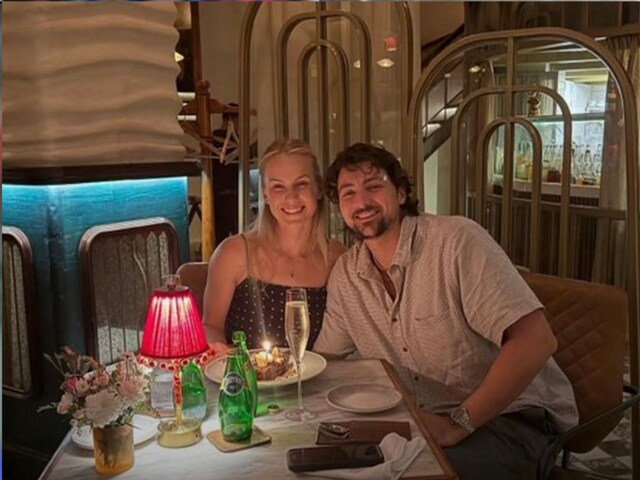 Who is that woman? On whose direction does Tim David hit long sixes?