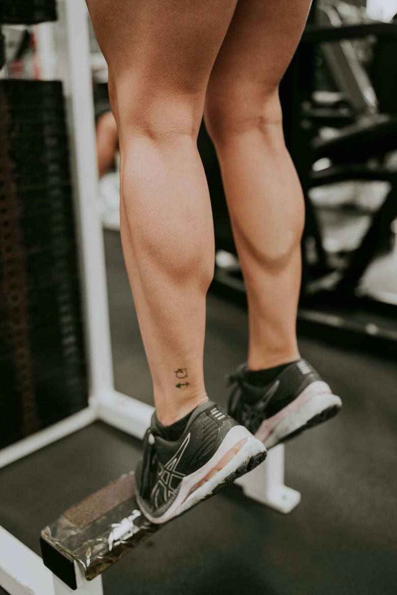 Calf Raises: Stand tall and lift your heels until you are balanced on the balls of your feet. Hold for a second before slowly lowering back down. Consistent repetitions define the lower leg, giving the calves a sleek, toned appearance and improving ankle stability. Calf Raises: Stand tall and lift your heels until you are balanced on the balls of your feet. Hold for a second before slowly lowering back down. Consistent repetitions define the lower leg, giving the calves a sleek, toned appearance and improving ankle stability.