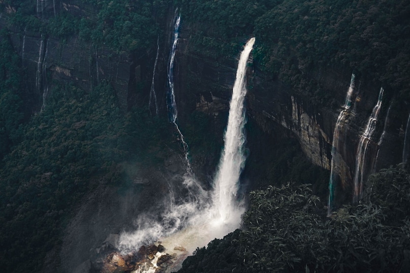 Cherrapunji, Meghalaya: Known as one of the wettest places on Earth, Cherrapunji is a land of dramatic waterfalls and living root bridges. The monsoon brings fierce beauty to the Khasi Hills, with clouds floating through valleys and the roar of Nohkalikai Falls. Cherrapunji, Meghalaya: Known as one of the wettest places on Earth, Cherrapunji is a land of dramatic waterfalls and living root bridges. The monsoon brings fierce beauty to the Khasi Hills, with clouds floating through valleys and the roar of Nohkalikai Falls.