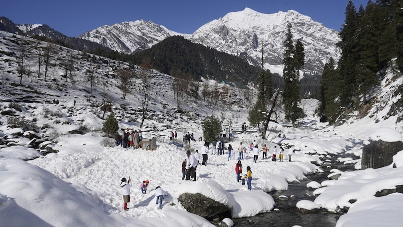 Pahalgam: Tourists visit Pahalgam after fresh snowfall, in Anantnag district of South Kashmir, Wednesday, March 5, 2025. (PTI Photo/S Irfan) (PTI03_05_2025_000264B)