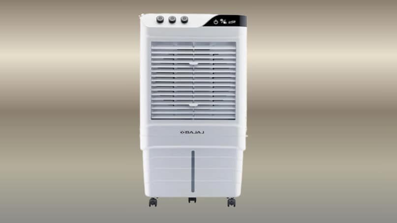 Bajaj DMH 90 Neo 90L Desert Air Cooler- Bajaj DMH 90 Neo 90L Desert Air Cooler बड़े कमरों और तेज गर्मी के लिए एक पावरफुल कूलिंग समाधान है. इसमें 90 लीटर का बड़ा वॉटर टैंक दिया गया है, जो लंबे समय तक कूलिंग सुनिश्चित करता है. इसका हाई एयर डिलीवरी सिस्टम, मजबूत हनीकॉम्ब कूलिंग पैड और प्रभावी एयर सर्कुलेशन बड़े एरिया को जल्दी ठंडा करने में मदद करता है. यह इन्वर्टर कम्पैटिबल भी है. कीमत - ₹11,999